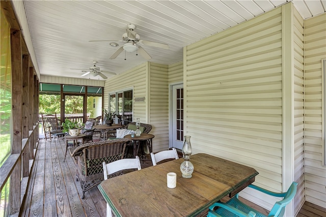 sunroom / solarium with wooden ceiling and ceiling fan