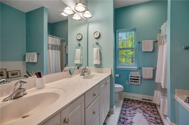 full bathroom featuring shower with separate bathtub, vanity, tile patterned flooring, and toilet