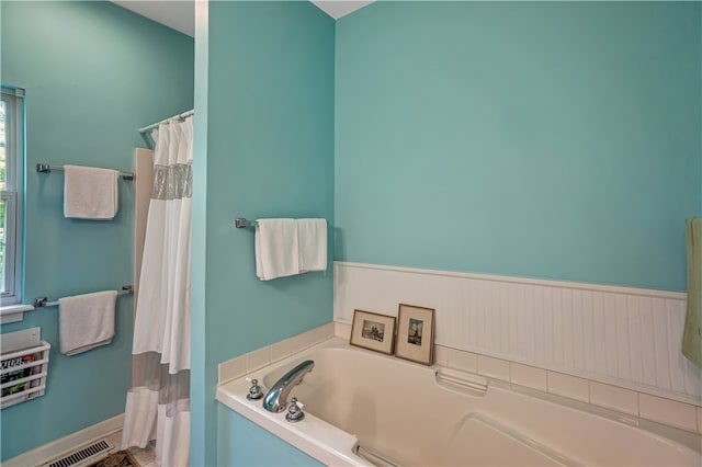 bathroom with a bathing tub