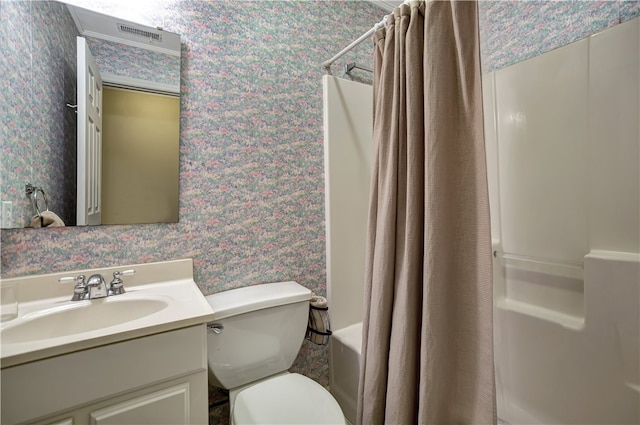 full bathroom featuring shower / bathtub combination with curtain, vanity, and toilet