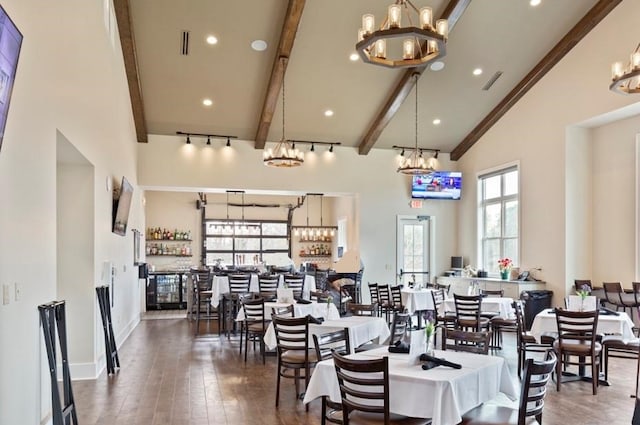 dining space with high vaulted ceiling, beam ceiling, and dark hardwood / wood-style flooring