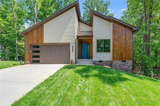 modern home with a garage, driveway, a front lawn, and crawl space