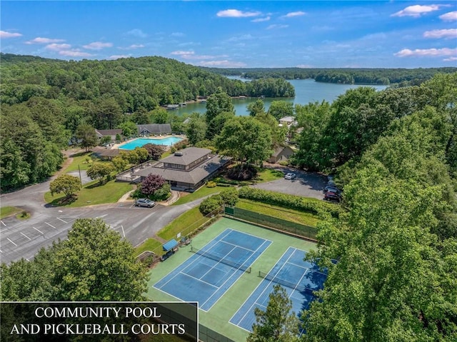 aerial view featuring a water view and a view of trees