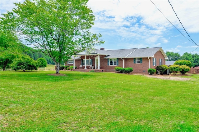 ranch-style home with a front lawn