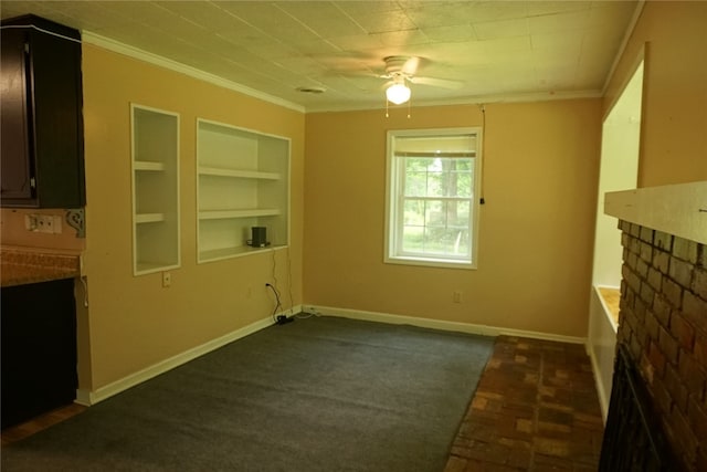 interior space with ornamental molding, ceiling fan, built in features, and dark carpet