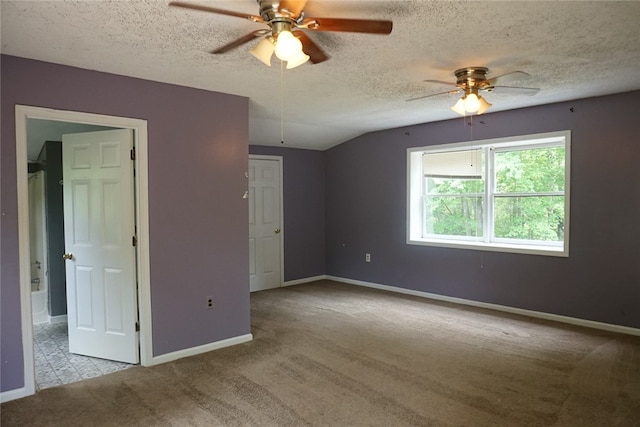 unfurnished bedroom featuring a textured ceiling, light carpet, and ceiling fan