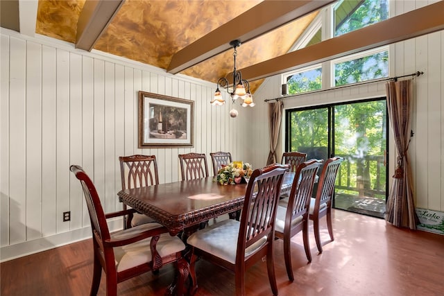 dining room with wood-type flooring, wood walls, lofted ceiling with beams, and a chandelier