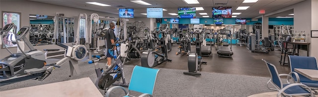 workout area featuring a paneled ceiling