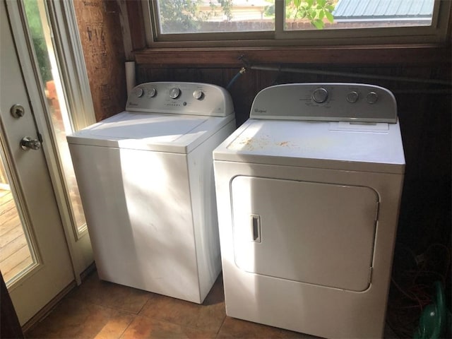 laundry area featuring tile patterned floors and separate washer and dryer