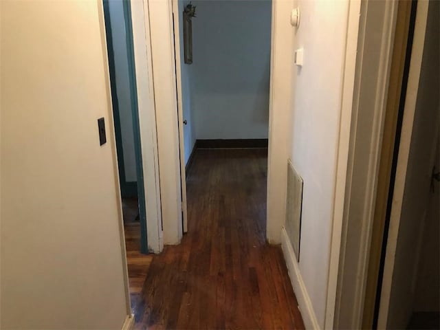 hall with dark hardwood / wood-style flooring