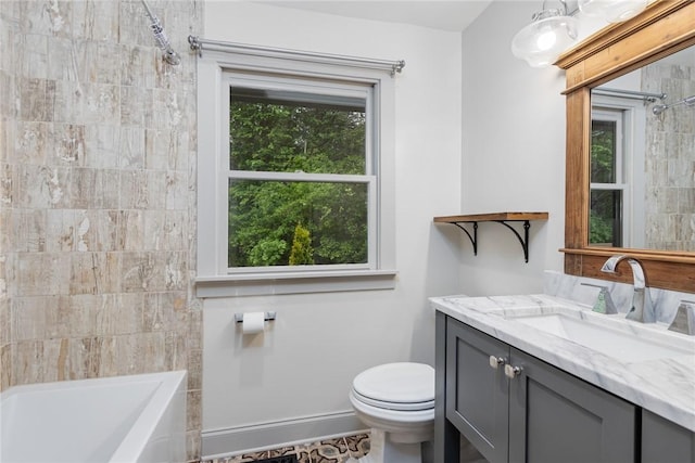 bathroom with toilet, vanity, and shower / washtub combination