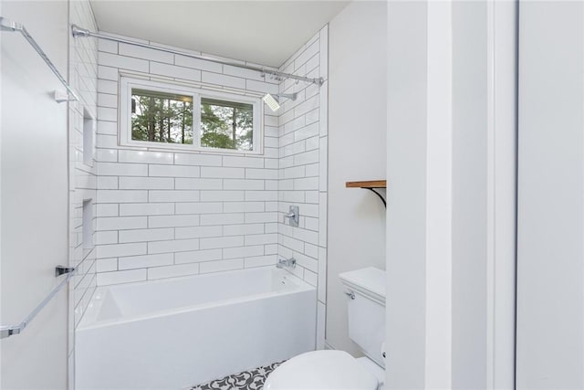 bathroom featuring shower / bath combination and toilet