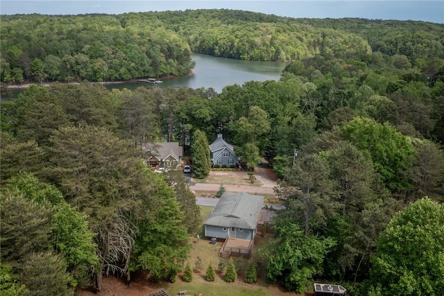 drone / aerial view with a view of trees and a water view