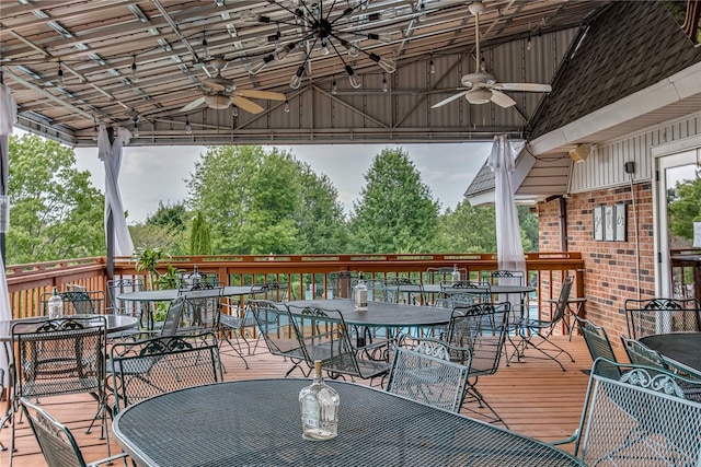 wooden deck featuring ceiling fan