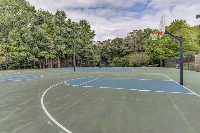 view of sport court with fence, community basketball court, and a tennis court