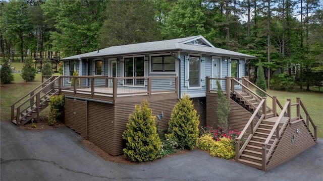 view of outbuilding featuring stairs