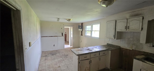 kitchen with sink and light tile patterned flooring