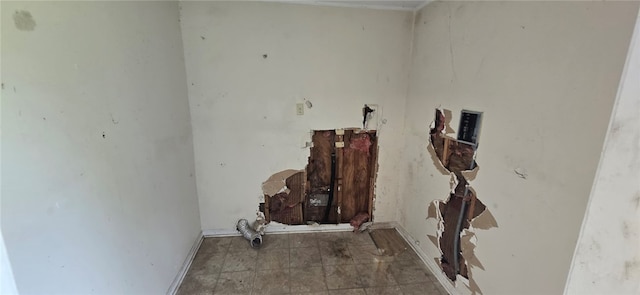 laundry area featuring tile patterned flooring