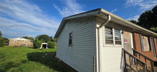 view of home's exterior featuring a yard