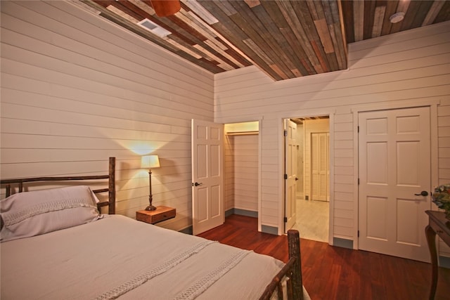 unfurnished bedroom featuring dark hardwood / wood-style floors and wooden ceiling