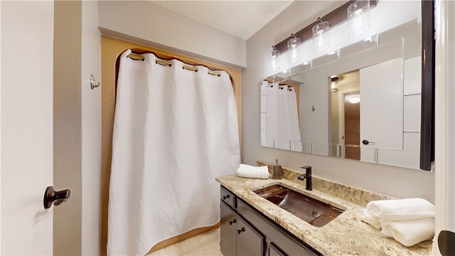 bathroom with vanity and tile patterned flooring