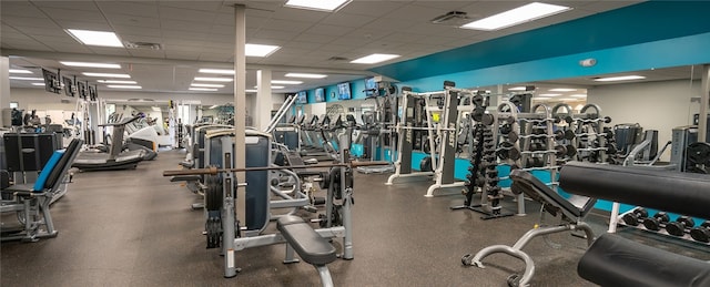 gym featuring a paneled ceiling