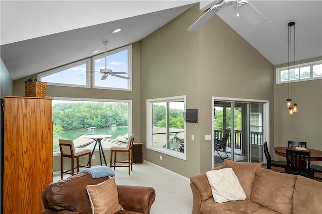 living room featuring high vaulted ceiling, ceiling fan, and carpet flooring