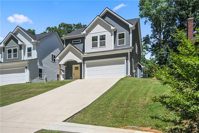 craftsman house featuring a garage and a front lawn