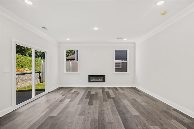 unfurnished living room with ornamental molding and wood-type flooring