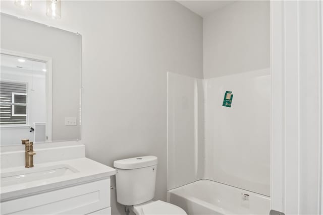 full bathroom with vanity, toilet, and washtub / shower combination