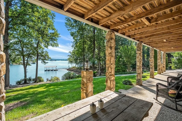 view of patio with a water view