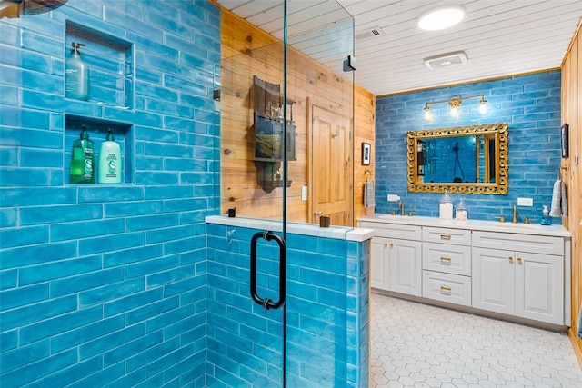 bathroom featuring vanity, a shower with shower door, and wooden ceiling