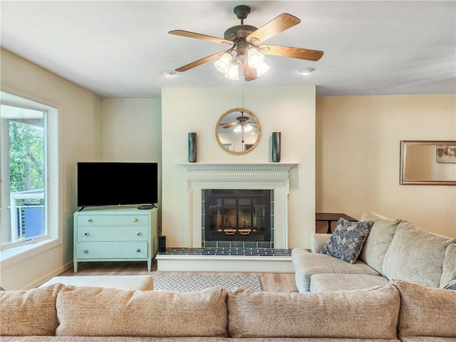 living room featuring ceiling fan and wood-type flooring