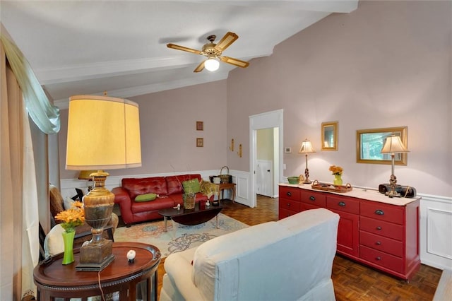 living room with ceiling fan, lofted ceiling with beams, and dark parquet flooring