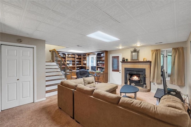 carpeted living room featuring a brick fireplace