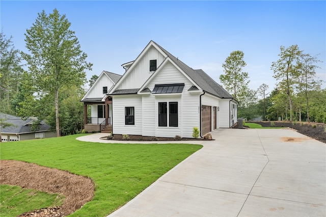 view of front of house with a garage and a front yard