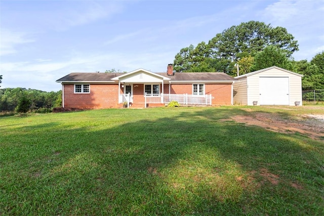 view of front of house featuring covered porch, an outdoor structure, and a front lawn