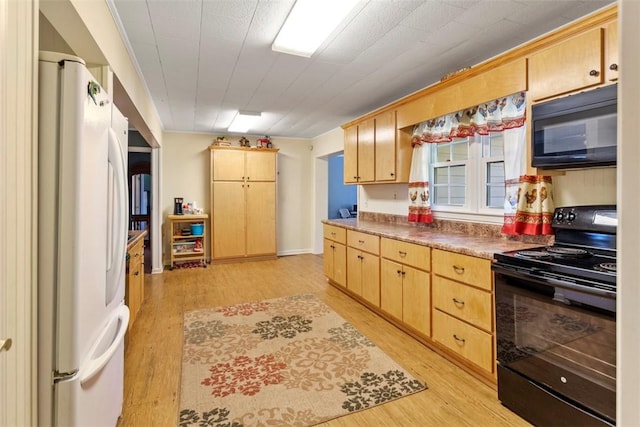 kitchen featuring light brown cabinets, black appliances, and light hardwood / wood-style floors