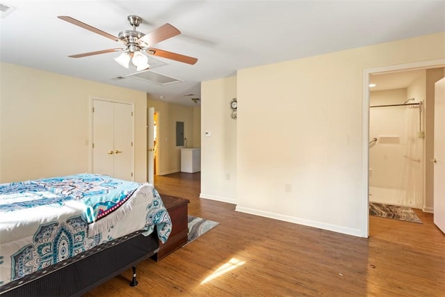 bedroom featuring ensuite bath, ceiling fan, and dark hardwood / wood-style floors