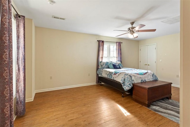 bedroom with ceiling fan and hardwood / wood-style floors