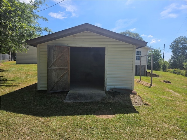 view of outdoor structure with a yard