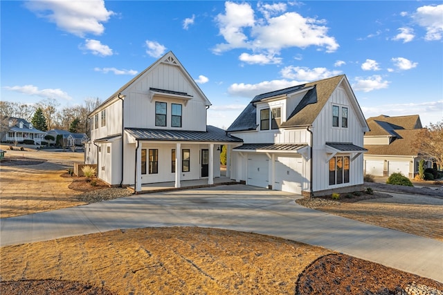 modern inspired farmhouse with a garage