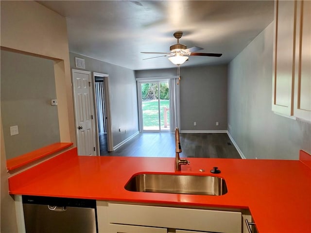 kitchen with white cabinetry, dishwasher, wood-type flooring, sink, and ceiling fan