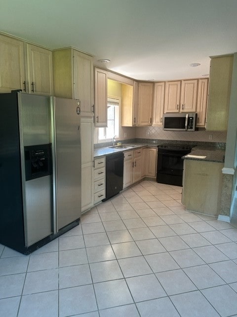 kitchen with light brown cabinets, light tile patterned floors, black appliances, and sink