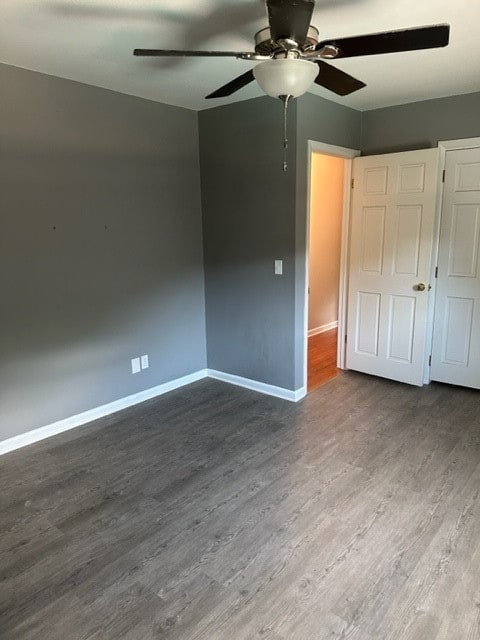 unfurnished bedroom featuring ceiling fan and wood-type flooring