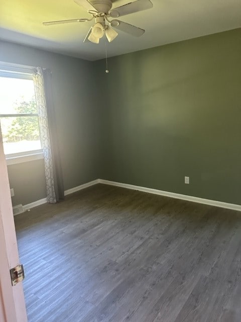 spare room featuring ceiling fan and wood-type flooring