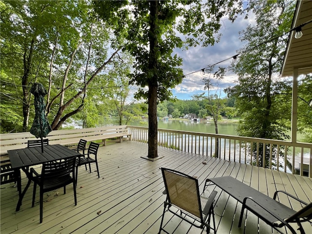 wooden terrace featuring a water view