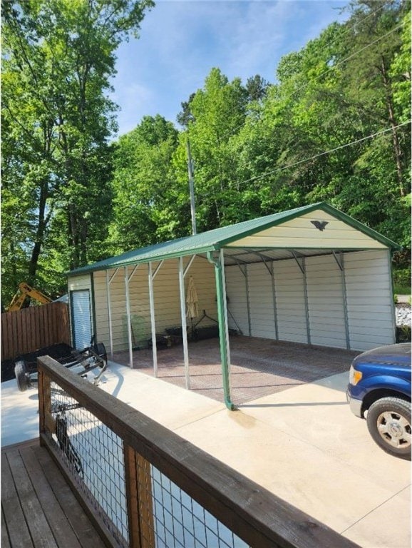 wooden deck featuring a carport