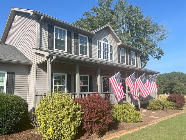 colonial house featuring a porch