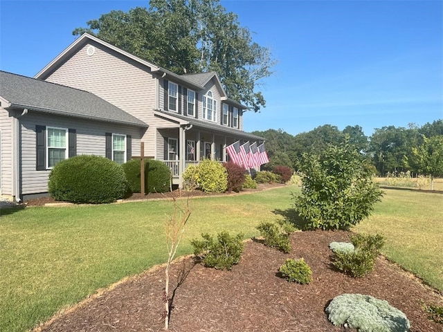 view of front of house with a front lawn and covered porch